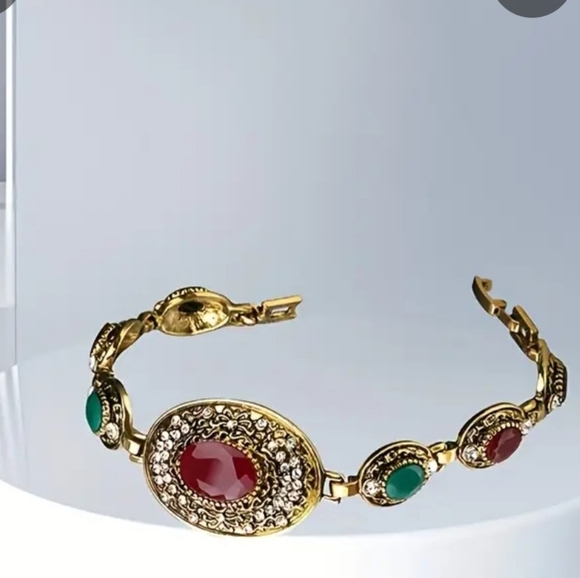Elegant Gold Bracelet with Red and Green Accents - Picture 1 of 2